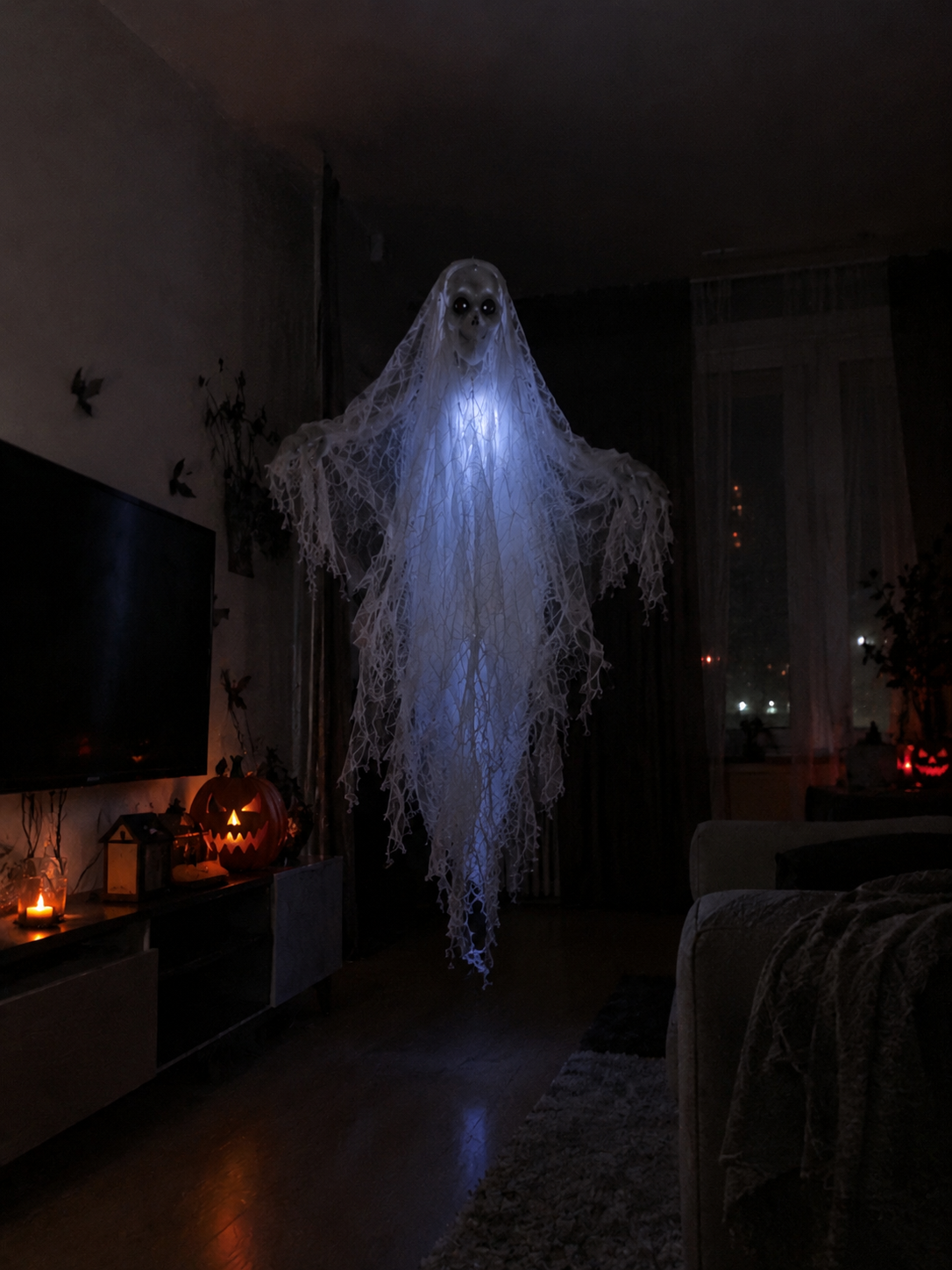 Glowing flying ghost floating in a dark living room